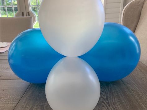 How to Make a Balloon Banner, Balloon Backdrop, or Balloon Garland - Happy Haute Home Tying Balloons Together, How To Tie Balloons Together, Tie Balloons Together, School Function, 80 Birthday, Blowing Up Balloons, Balloon Garland Diy, Round Balloons, Balloon Pump