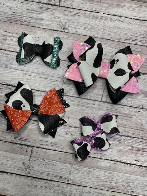 Beautiful handmade bow made of a high quality faux leather fabric and/or glitter fabric that does not shed.

These bows are perfect for kids of all ages!

Details:
Pink Glitter and Cow Print:
-Made with Black Matte, Pink Chunky Shimmer and Cow Print faux leather.
-Approx 4"x3"
-Alligator Clip (single prong with teeth) School Hair Bows, Flower Hair Bows, Cricket Ideas, Glitter Hair Bows, Cow Painting, Pink Cow, Matte Pink, Glitter Hair, Ribbon Crafts