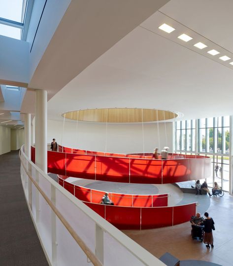 [Image description: People descending a spiraling ramp with bright red walls.] Designing for accessibility can be an opportunity, both creative and economic. It inspired the helical design of the Ed Roberts Campus in Berkeley, Calif., by Leddy Maytum Stacy Architects. Ramp And Stairs Architecture, Ramps Architecture, Ramp Stairs, Ramp Design, New York Architecture, Stairs Architecture, American Architecture, Hunter Douglas, Inclusive Design