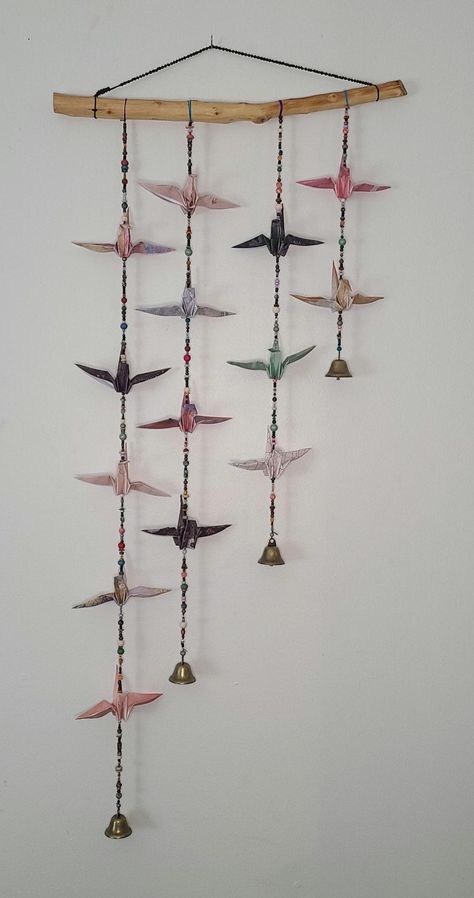 Origami cranes suspended on beaded strands of thread from a handmade wooden dowel. Origami Crane Decoration, Origami Decoration Wall, Origami Goldfish, Cool Origami, Paper Crane Mobile, Origami Lantern, Origami Garland, Origami Wall Art, Crane Mobile