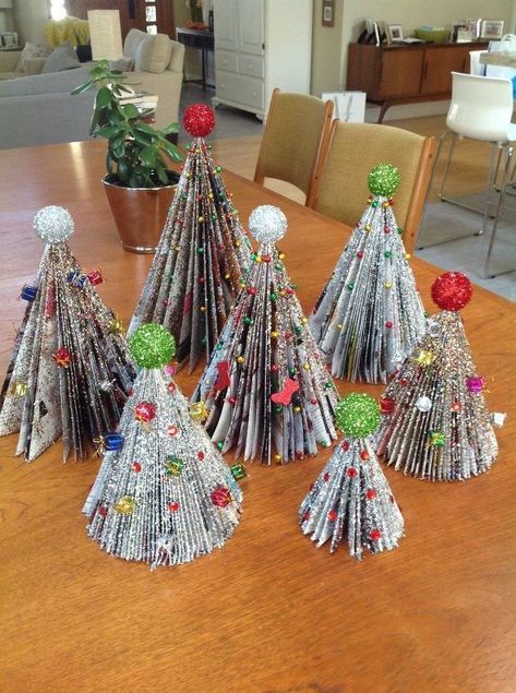 Best to google Magazine Christmas Trees and view a very very easy tutorial on the folding process! #ad Diy Christmas Trees, Trees Diy, Old Book Crafts, Recycled Magazines, Magazine Crafts, Folded Book Art, Unique Christmas Trees, Tabletop Christmas Tree, Christmas Tree Crafts