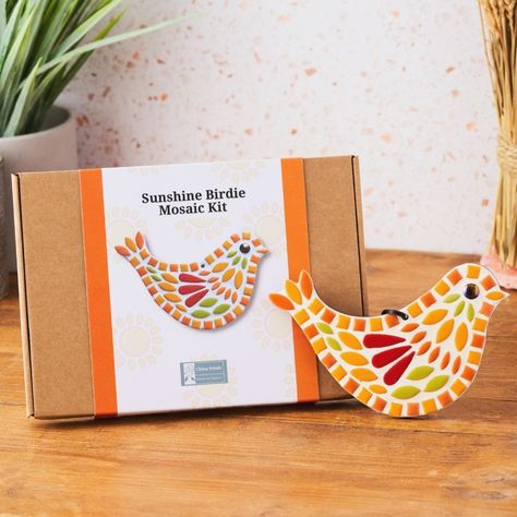 Bright mosaic bird next to a box which is the kit to create the mosaic.  The bird is in yellow, greens, reds and orange. Dotting Patterns, Bird Mosaic, Small Mosaic, Mosaic Art Diy, Mosaic Flower Pots, Mosaic Animals, Mosaic Kits, Mosaic Birds, Mosaic Kit