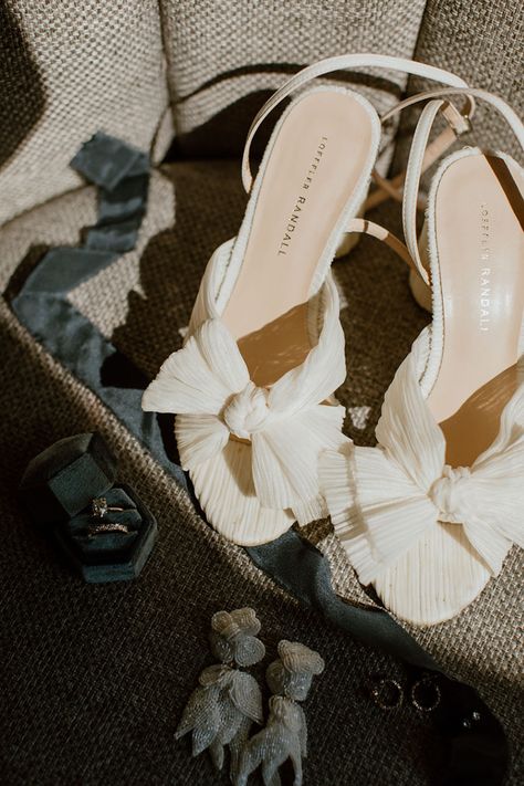 Ivory Loeffler Randall Dahlia Pleated Bridal Heels with Bow Details Wedding Heels Bow, Bridal Shoes With Bow, Wedding Heels With Bow, Bow Heels Wedding, Tropical Arrangements, The Cordelle, Wedding Shoes Bow, Moodboard Wedding, Bridal Aesthetic