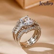 https://encrypted-tbn0.gstatic.com/images?q=tbn:ANd9GcTLiFWfZkQmymmIDcf_8Nb3-9rnUVXtDnDxoQ&usqp=CAU 10 Year Wedding Ring, Wedding Ring Upgrade, Asscher Cut Diamond Engagement Ring, Jeulia Jewelry, Expensive Wedding Rings, Ring My Bell, Emerald Cut Diamond Engagement Ring, Wire Jewelery, Sterling Silver Wedding Rings