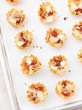 4 Easy, Make-Ahead Appetizers That'll Wow Your Guests - Shown are brie, red pepper jelly and smokehouse almonds in  filo cups From America's Test Kitchen Brie Cups, Filo Cups, Magazine Recipe, Currant Jelly, Illustrated Recipes, Mini Pecan Pies, Savory Treats, Make Ahead Appetizers, America's Test Kitchen Recipes