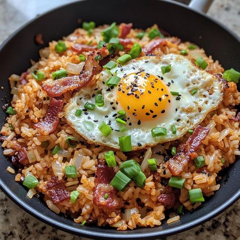 🍚 "Try Kimchi Fried Rice with Bacon for a savory, satisfying meal packed with flavor and a hint of spice!" 🍚🥓 #KimchiFriedRice #SavoryDelight Kimchi Fried Rice with Bacon Ingredients: Cooked rice (2 cups) Kimchi (1 cup, chopped) Bacon (4 slices, chopped) Onion (1/2 cup, diced) Garlic (2 cloves, minced) Soy sauce (2 tbsp) Sesame oil (1 tbsp) Green onions (1/4 cup, chopped) Egg (1, optional) Instructions: Cook bacon in a pan until crispy, then remove and set aside. In the same pan, sauté on... Rice And Bacon Recipes, Fried Rice With Bacon, Bacon Fried Rice, Soy Sauce Rice, Food To Try, Egg Fried Rice, Kimchi Fried Rice, Asian Street Food, Cooked Rice