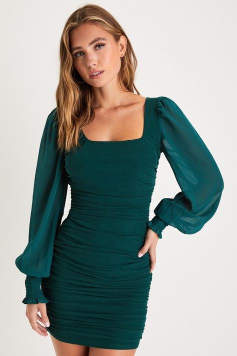 There's nothing better than feelin' fine and ready to party in the Lulus Perfect Sensation Dark Green Mesh Ruched Puff Sleeve Mini Dress! Slinky knit mesh (atop green knit lining) is ruched throughout this sexy bodycon dress that has a square neckline, a fitted bodice, and long puff sleeves with smocking at the cuffs. The figure-hugging skirt falls to an alluring mini hem. Hidden back zipper/clasp. Fit: This garment fits true to size. Length: Mid-thigh. Size medium measures 33" from shoulder to hem. Bust: Great for any cup size. Waist: Fitted - very fitted at natural waist. Hip: Fitted - stretchy fabric allows room for hips. Undergarments: May be worn with any standard bra. Fabric: Fabric has some stretch. Lined. Shell: 90% Polyester, 10% Spandex. Contrast & Lining: 100% Polyester. Hand Wa Hoco Dresses Tight Long Sleeve, Dark Green Hoco Dress, Long Sleeve Hoco Dress, Winter Ball Dresses, Green Hoco Dress, Fall Formal Dresses, Semi Dresses, Hoco Dresses Long Sleeve, Green Bodycon Dress