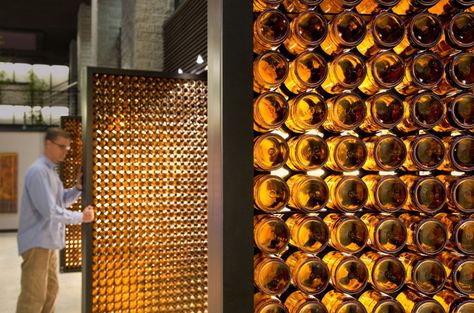 The Blatz / Johnsen Schmaling Architects #glass #reuse Blatz Beer, Reuse Bottles, Wine Bottle Wall, Brewery Design, Brown Bottles, Bottle Wall, Beer Bottles, Pivot Doors, Retail Design Blog