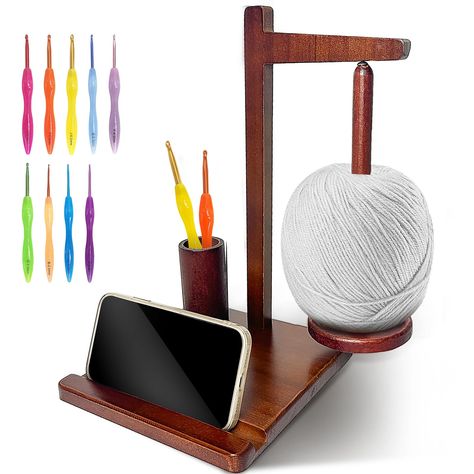 PRICES MAY VARY. Quality Material: The Yarn Holder for Crocheting Is Made Of Wood Material, Tough And Durable, Not Easy To Be Damaged. The Surface Is Finely Polished And Painted, Smooth And Not Hurt Hands, No Odour, Wood Grain Is Clearly Visible And Texture Is Enhanced. Magnetic & Rotation: The Crochet Yarn Holder Adopts A Magnetic Suction Design, Wooden Spindles Rotates 360°, Rotating Smoothly, No Need To Worry About Tangling. Multiple Functions: This crochet yarn holder is combines a rotating Yarn Holder For Crocheting, Crochet Yarn Holder, Sewing Supplies Storage, Yarn Holder, Ball Holder, Yarn Storage, Yarn Ball, Crochet Lovers, Cell Phone Holder