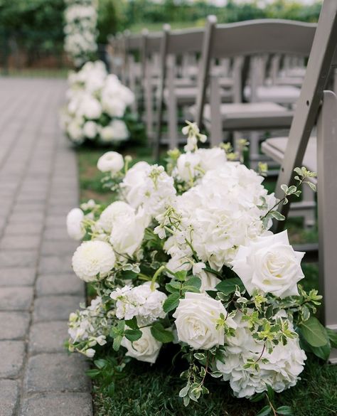 Rounded aisle arrangements with a mixtures of hydrangea, white roses, dahlias, white bella donnas, minipit and stock. ⁠ ⁠ Venue @palmeventcenter⁠ Photographer @apollofotografie⁠ ⁠ #blackandwhitewedding #whiteflowers #weddingday #fabulous #florist #bayareaweddingflorist #stylemepretty #theknot #whitewedding #elegance #flowers #wedding day ⁠ White Aisle Arrangements, Aisle Arrangements, Wedding Walkway, Hydrangea White, Aisle Markers, Ceremony Aisle, Altar Flowers, Flower House, Aisle Flowers