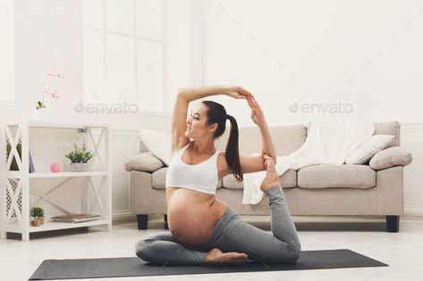 Happy pregnant woman training yoga in camel pose by Prostock-studio. Happy pregnant woman training yoga in camel pose at home. Motherhood, active pregnancy, happiness, training, yoga con... #AD #yoga, #camel, #pose, #training Prenatal Yoga Poses, Maternity Workout Clothes, Pregnancy Yoga Poses, Yoga Prenatal, Yoga Poses Photography, Yoga Photoshoot, Different Types Of Yoga, Studio Pilates, A Pregnant Woman