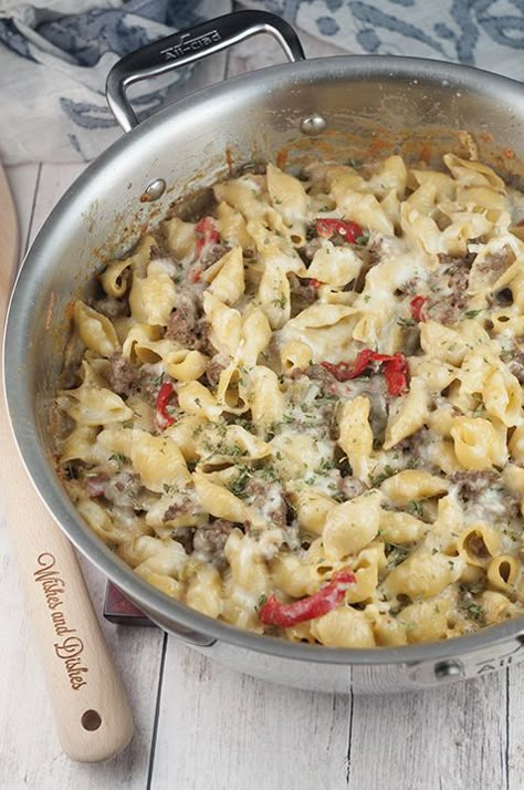 This easy dinner recipe for Philly Cheesesteak Pasta is a cheesy comfort food dish that will become a new family favorite! Philly Cheesesteak Pasta, Cheesesteak Pasta, Wishes And Dishes, Philly Cheese, Hot Italian Sausage, Homemade Hamburgers, Easy Dinner Recipe, Philly Cheesesteak, Philly Cheese Steak