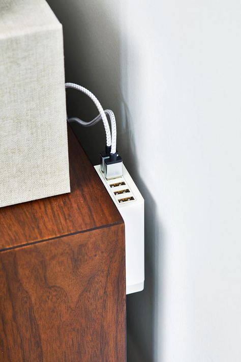 Genius Ways to Organize Electronics, Games & Media Nightstand Cable Management, Electronic Organization Storage, Nightstand Cord Organization, Desk Charging Station, Hidden Charging Station Ideas, Hidden Game Console, Family Charging Station Ideas, Cable Tidy Ideas, Game Console Organization