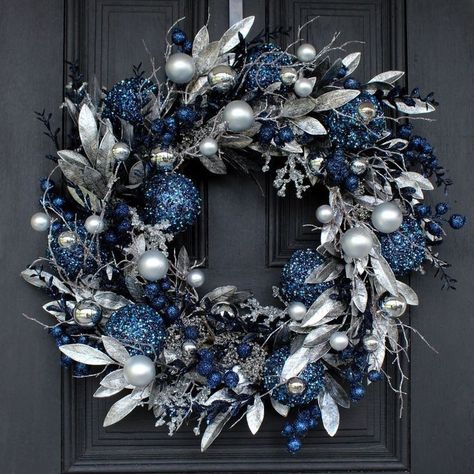 This color combination is one of my fiancee's favorite.
*
*
I linked the ornaments for you to recreate this look. We all love more than a little DIY Silver Christmas Wreaths For Front Door, Elegant Christmas Trees Blue, Blue Holiday Wreaths, Blue Wreath Christmas, Outdoor Decor For Christmas, Blue Christmas Wreaths For Front Door, Christmas Decorations Blue And Silver, Christmas Wreath Blue, Blue And Silver Wreath