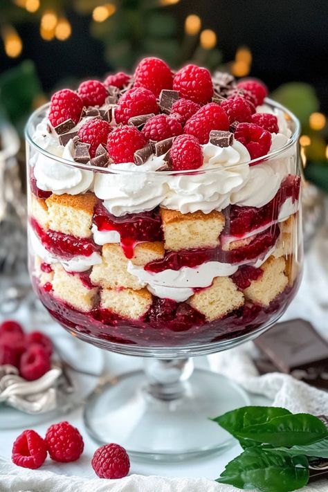 This raspberry trifle recipe will impress your guests with its stunning presentation and irresistible flavors. It's the perfect dessert for any occasion. British Trifle Recipe, Flambe Desserts, Chocolate Trifle Desserts, Christmas Dessert Tray, Christmas Trifle Recipes, Homemade Christmas Cake, Easy Trifle, Raspberry Trifle, Fancy Food Presentation