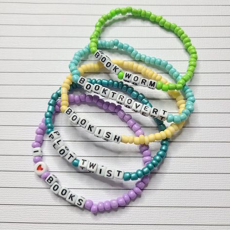 📚✨ Calling all bookworms! Elevate your reading game with our enchanting new word bracelets, exclusively available in the Etsy shop! Each bracelet is crafted to showcase your love for literature. Customize one inspiring quotes and titles that resonate with your soul. Wear your favorite pastimes on your wrist, and let your literary spirit shine wherever you go! Tap the link in my bio to shop Etsy now! 💖📖 #bookishjewelry #etsyfinds #doohickiesnsuch #literarylove #bookworms #avidreader #booktro... Personalized White Novelty Friendship Bracelets, Bookish Bracelet, Bookish Beaded Bracelets, Crystal Word Bracelet, Positive Word Bracelet, Reading Games, Word Bracelet, Avid Reader, New Words