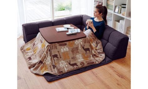 Winter is coming. Japan is ready, but how are you going to stay warm. You need a kotatsu. This brilliant creation is a combo of space heater, blanket, and flat table (or a variation thereof). A picture, in this case truly, is worth more than a thousand words. All-knowing Wikipedia defines a kotatsu as a “low, wooden table frame covered by a futon, or heavy blanket, upon which a table top sits. Un... Read more: Kokatsu from Belle Maison Japanese Couch, Japanese Style Bed, Best Home Business, Apartment Sofa, Japanese Interior, Table Frame, Getting Out Of Bed, Home Business, Getting Cozy