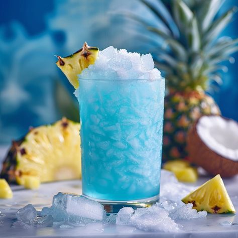 🍹 Dive into a tropical paradise with Blue Caribbean! #TropicalDrinks #IslandVibes Blue Caribbean Ingredients: White rum (1 oz) Blue curaçao (1 oz) Pineapple juice (2 oz) Coconut cream (1 oz) Ice cubes Instructions: Combine all ingredients in a blender with ice. Blend until smooth and pour into a glass. Enjoy this vibrant and refreshing tropical drink! 🍹🌴 #CocktailTime #SummerVibes Instagram Recipes, Blue Desserts, Twisted Recipes, Blue Curacao, Tropical Drink, White Rum, Trending Recipes, Island Vibes, Pineapple Juice