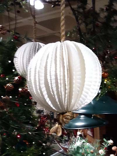 We just returned from market a few days ago and one of the show rooms had these paper lanterns hanging in the entrance. They were really pretty and while w Paper Plate Lantern, Lanterns Hanging, Daycare Decor, Wreath Making Supplies, Valentine Decor, Cup Crafts, How To Make Lanterns, Paper Plate Crafts, Plate Crafts