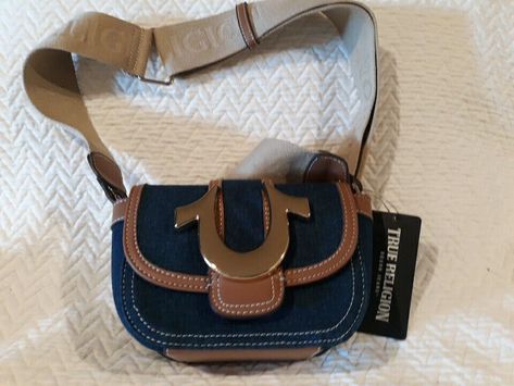 NWT True Religion purse. Large gold logo on flap of bag. Adjustable strap bag. Great denim fabric. Please look closely at the photos and ask any questions you have. Thanks and Happy Ebaying!! True Religion Bag, Adjustable Strap Bag, Strap Bag, Fancy Bags, Gold Logo, Denim Fabric, True Religion, Crossbody Bag, Adjustable Straps