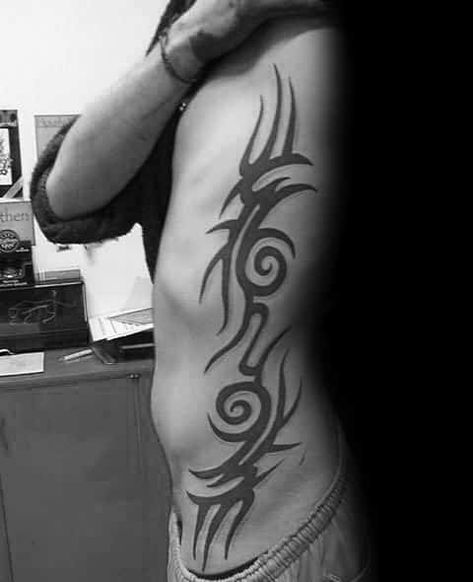 Top 40 Best Tribal Rib Tattoos For Men - Manly Ink Design Ideas Tattoo Trends 2023, Mens Side Tattoos, Trible Tattoos, Griffin Tattoo, Rib Tattoos For Guys, Tattoos On Side Ribs, Behind Ear Tattoos, Unique Tattoos For Men, See Tattoo