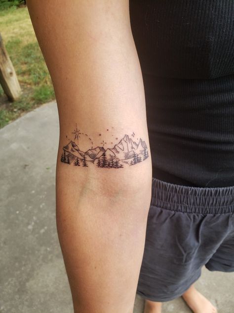 Mountain Tattoo Above Elbow, Olympic Mountains Tattoo, White Mountains Tattoo, Wyoming Mountain Tattoo, Elegant Mountain Tattoo, Mountain Bracelet Tattoo, Mountain Aesthetic Tattoo, Mountain Bicep Tattoo, Mountain Wildflower Tattoo