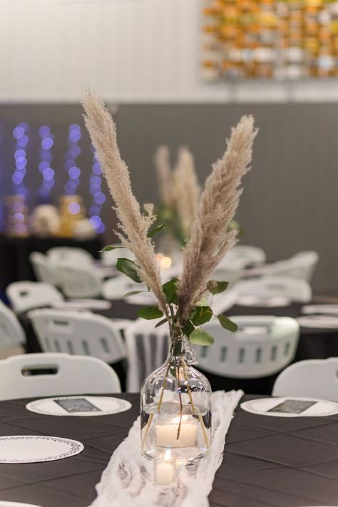 Simple and easy wedding reception centerpieces! Fake pampas grass from Hobby Lobby and live eucalyptus from local florist. Plain cheesecloth as runners and tealights on the sides. Jugs from Amazon. #centerpiece #wedding #pampasgrass #eucalyptus #cheap #easy Pampas Grass Eucalyptus Wedding, Eucalyptus Wedding Centerpieces, Eucalyptus Wedding Centerpiece, Eucalyptus Centerpiece, Yeast Starter, Wedding Reception Centerpieces, Eucalyptus Wedding, Glass Water Bottle, Local Florist