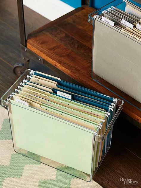 Do set up file boxes to organize papers you use monthly. Store the file boxes on a shallow table or bookcase to keep your desktop clutter free. Use four different colors of hanging file folders to help you easily distinguish between financial, insurance, personal, and household documents. Hanging File Organizer, Craft Paper Storage, Office Organisation, File Boxes, Office Organization At Work, Diy Rangement, Folder Organization, Hanging File Folders, Office Supply Organization