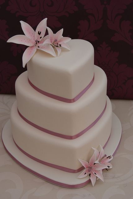 Lilies Heart Wedding Cake by Cakes by Occasion, via Flickr Heart Shaped Wedding Cakes, Cake Heart, Heart Wedding Cakes, Heart Cakes, Heart Shaped Cakes, Wedding Cakes Blue, Gateaux Cake, Wedding Cakes With Cupcakes, Elegant Wedding Cakes