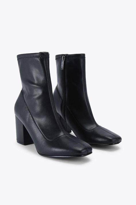 This Carvela Strut Ankle boot features a black upper with soft ankle and softly squared toe. There is a gunmetal micro Icon C stud at the back of the ankle. Heel height: 5cm. Petite Jumpsuit, Lace Skater Dress, Trending Boots, Cold Weather Outfits, Fit N Flare Dress, Sunglasses Shop, Boots For Sale, Denim Outfit, Jeans For Sale