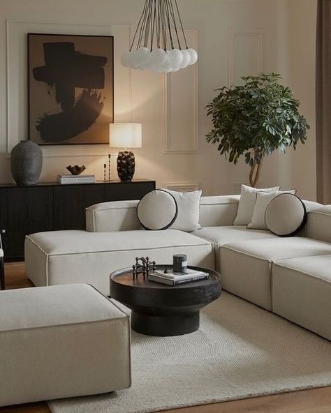 Beige Couch With Black Coffee Table, Black Beige Home Decor, Brown Black And White Living Room Minimalist, Cream And Black Sofa, Beige Interior With Black Details, Black And Cream House Decor, White Sofa Black Coffee Table, Black Furniture Design, Beige Sofa Black Coffee Table