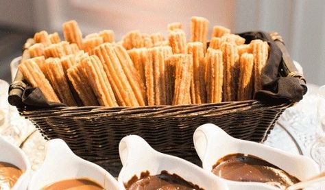 Set up for churros at a table in a basket Churro Display, Churro Party, Ideas Matrimonio, 25th Anniversary Party, Mexican Wedding, Anniversary Party, Anniversary Parties, 25th Anniversary, A Table