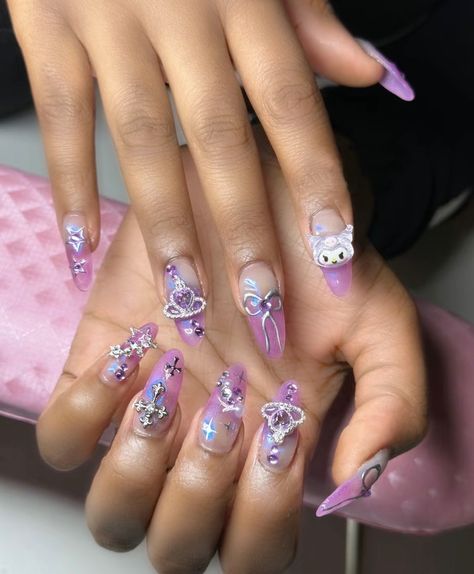 ombre nails, sanrio nail inspo, kuromi, nails with stars bows charms and cyber aesthetic (creds to nailssbymelek) Sanrio Nails Aesthetic, Charms Nails Ideas, Sanrio Aesthetic Nails, Sanrio Nails Kuromi, Sanrio Charm Nails, Purple Nails With Charms, Kuromi Nails Short, Nail Inspo Charms, Kuromi Acrylic Nails