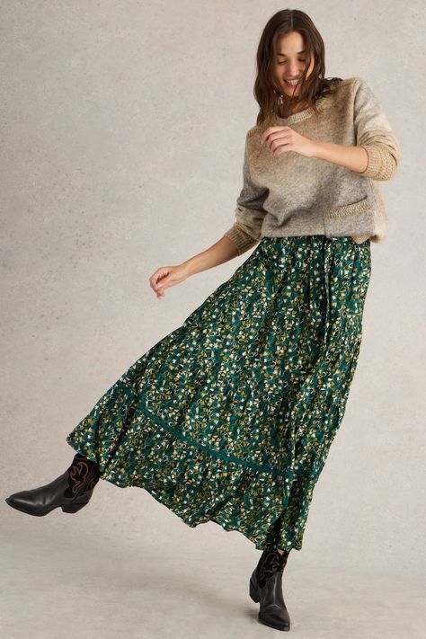 There's something about this organic cotton maxi skirt that makes us want to sweep across the countryside like a Jane Austen heroine. Though we prefer to team ours with cowboy boots and jumpers. (Petticoats and aprons aren't really our thing.) Machine washable. 100% Organic cotton. Skirt Cowboy Boots, Cotton Maxi Skirt, Green Maxi Skirt, Skirt Jumper, Cotton Maxi Skirts, Maxi Skirt Outfits, Skirts With Boots, Tiered Maxi Skirt, White Stuff