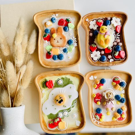 These cuties also coming to my shop tomorrow at 11:00 am EST! These adorable, food-themed trays are crafted in the shape of bread slices, and decorated with playful designs featuring characters like a bunny, a duck, and cute bears, along with colourful fruits and flowers. The intricate details, such as the blueberries, strawberries, and even a fried egg, create a cheerful and whimsical look that evokes the coziness of a fun breakfast. These trays can serve as versatile pieces, functioning a... Yellow Duckling, Adorable Food, Fun Breakfast, Blush On Cheeks, Breakfast Toast, Pink Scarf, Handmade Wall Hanging, Colorful Fruit, Red Bell Pepper