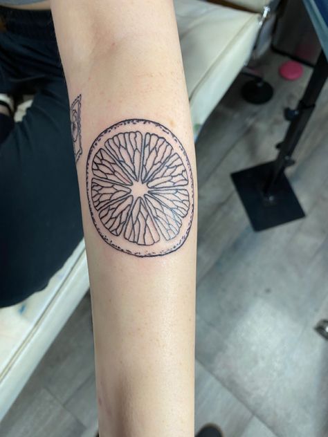 orange slice tattoo Sliced Orange Tattoo, Tattoos Of Oranges, Grapefruit Slice Tattoo, Half An Orange Tattoo, Orange Slice Tattoo Traditional, Orange Fruit Tattoo Black And White, Orange Half Tattoo, Tattoo Of An Orange, Orange Slice Tattoo Black And White