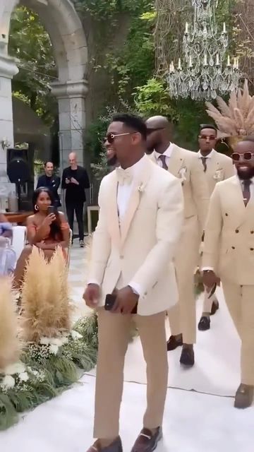 Everythingwedding Global on Instagram: "We love seeing y’all show love to the Groom and Groomsmen! It’s their day too!! ❤️ 💐 But we’re ready to see what the Ladies are looking like if this is just the beginning of the Wedding Party 🙌🏾 🎥 @mrtn.dbrh #groomsmen #groom #mensfashion #father #marriagegoals #instadaily #vows #baby #instagood #energy #reels #style #bridesmaids #happy #explorepage #blacklove . #explore #fashion #weddingphotography #luxury life #goodvibes #trending #photooftheday #vi Trending Grooms Suits, Cream Wedding Suit Black Man, Gold And White Groom Suit, Champagne Gold Groomsmen Attire, White And Gold Wedding Groomsmen, Champagne Groomsmen Suits, Groomsmen Neutral Colors, Brown And Beige Wedding Theme, White And Gold Wedding Party