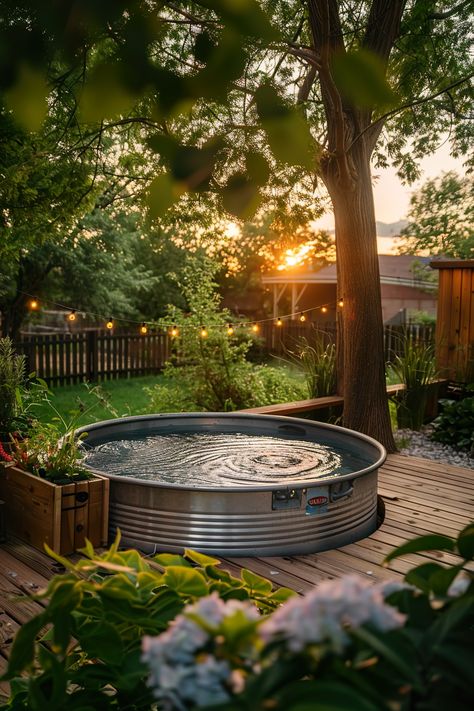 Backyard with a sunset view, featuring a galvanized stock tank pool on a wooden deck, surrounded by lush plants. Ideal for a DIY outdoor oasis. Backyard Stock Tank Pool Landscaping, Galvanized Pool, Pool Seating Ideas, Creative Bench, Stock Tank Pool Ideas, Diy Stock Tank Pool, Cowboy Pool, Pool Seating, Stock Pools