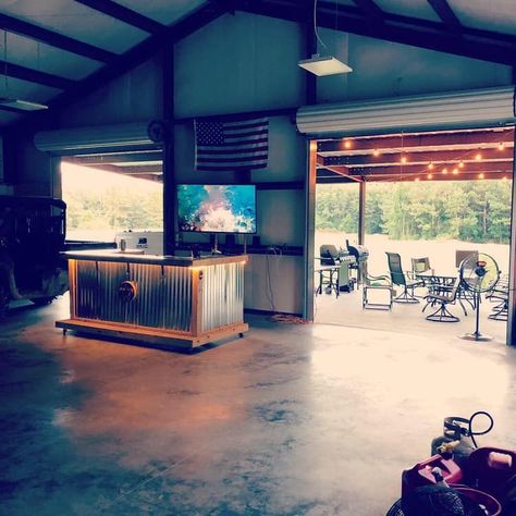 Garage For Entertaining, Barndominium With Roll Up Doors, Garage Party Room Ideas, Garage Entertaining Space Ideas, Shop With Entertaining Area, Shop With Bar Area, Barn Entertaining Space, Roll Up Garage Door Ideas, Garage Sitting Area Ideas