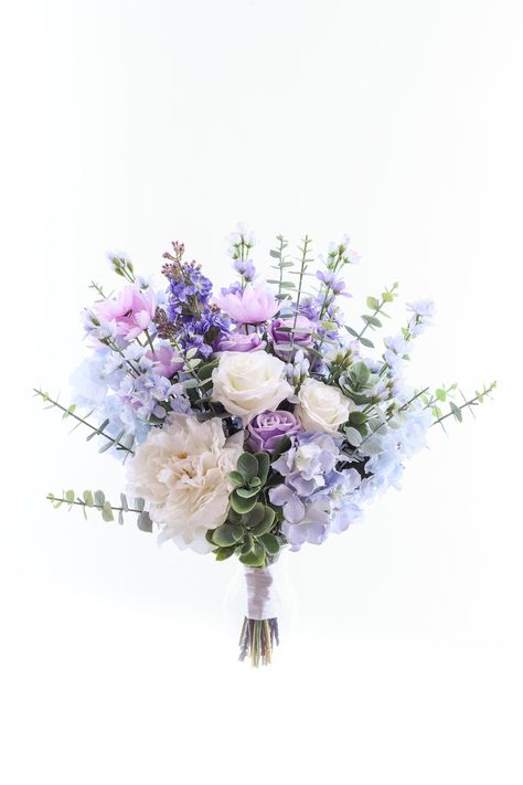 At Buketis we take pride in producing unique and luxurious floral designs. We use the best quality materials available and handcraft each item with care, as such we guarantee the quality of all of our handmade floral designs. A stunning addition to make your special day one to remember. This dusty blue bouquet not only looks fresh and realistic but will be a keepsake for a lifetime without the worries of wilting fresh flowers. This boho bouquet is made with high quality silk flowers such roses, Lavender Blue And White Bouquet, Lilac And Blue Bouquet, Dusty Blue And Lilac Wedding Bouquet, Purple And Blue Flower Bouquet, Blue And Purple Wedding Flowers, Dusty Blue And Lavender Wedding, Periwinkle Bouquet, Bridal Bouquet Mauve, Mauve Wedding Bouquet