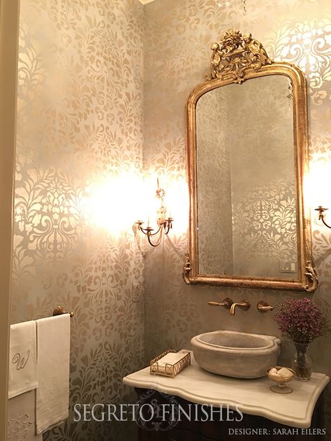 Stenciling over plaster with metallic paint gives the most romantic glow to any room! This application was perfect to marry the formal elements in this powder by designer Sarah Eilers.