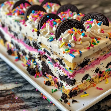 🎂✨ Try this No-Bake Funfetti Oreo Icebox Cake! Colorful, creamy, and oh-so-easy. #FunfettiOreoCake #NoBakeDessert No-Bake Funfetti Oreo Icebox Cake Recipe 🌟 Ingredients: 300g Funfetti Oreos, crushed 500ml heavy cream 100g powdered sugar 15ml vanilla extract 250g cream cheese, softened 100g sprinkles 100ml milk Instructions: Prepare the cream filling: In a bowl, beat heavy cream, powdered sugar, and vanilla extract until stiff peaks form. In another bowl, beat cream cheese until smooth. Fo... Birthday Baked Goods, Funfetti Oreo Cake Mix Recipes, Ice Cream Cake Oreo Crust, Funfetti Oreo Cake Mix Cookies, No Bake Funfetti Oreo Icebox Cake, Oreo Cookie Ice Cream Cake Recipe, No Bake Oreo Cake, Birthday Cake Oreo, Funfetti Oreo