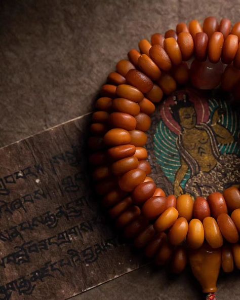 This exquisite African amber mala features a beautifully carved turquoise pendant depicting the Yellow Jambhala, the God of Wealth, with an auspicious deer on the back symbolizing good fortune. The mala includes 108 meticulously handpicked amber beads, each highlighting nature’s beauty and uniqueness. Complemented by a southern red agate top bead and a turquoise pendant, this rare piece comes with a certificate of inspection. Note that natural amber may contain unique pits and flaws, addi... God Of Wealth, Natural Amber, Amber Beads, Red Agate, Good Fortune, Turquoise Pendant, Tibet, Buddhism, Deer