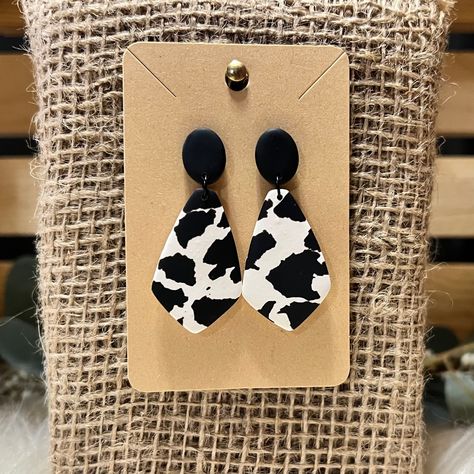 Handmade cow print polymer clay earrings with stud closure and stainless steel post Hypoallergenic- free of lead and nickel Clay earrings are lightweight and a comfortable option for all day wear  Due to the nature of handmade products, slight imperfections and differences may occur in each pair of earrings  Thank you for shopping handmade products! Cow Print Earrings, Cow Earrings, Earrings Clay, Steel Post, Earrings Statement, Simple Earrings, Handmade Products, Handmade Polymer Clay, Cow Print