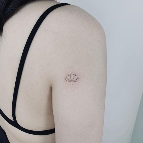 30 Lotus Tattoo Ideas That Symbolize Purity & Enlightenment | These lotus tattoos symbolize personal growth and enlightenment! Lifestyle Lotis Tattoo, Lotus Tattoo Ideas, Enlightenment Tattoo, Blue Lotus Tattoo, Small Lotus Flower Tattoo, Small Lotus Tattoo, Lotus Tattoos, Small Symbol Tattoos, Vietnam Tattoo