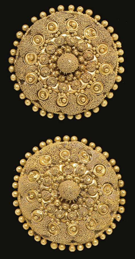 A PAIR OF ETRUSCAN GOLD DISKS   CIRCA LATE 4TH CENTURY B.C.   Each formed of domed sheet, encircled by granules, elaborately adorned in concentric rings, with clusters of granulation, filigree spirals centered by granules, clusters of granulation around larger granules, centered by a piriform knob embellished with granulation; mounted as earrings with modern gold backs and posts Etruscan Jewelry, Ancient Jewels, Roman Jewelry, Ancient Jewellery, Art Ancien, Historical Jewellery, Art Antique, Ancient Jewelry, Ancient Artifacts