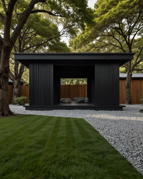 ◼️ Black Wooden Pavilion: A minimalist pavilion constructed from dark-stained wood, nestled amongst a serene Japanese garden with raked gravel and meticulously placed rocks. #japaneseaesthetic #minimalistlife #matteblackeverything #minimalismlifestyle #japaneseaesthetic #findpeace #natureinspired #architecturephotography #designinspiration #blackandwhitephotography #instagood #instadaily #photooftheday #travelgram #explorepage #picoftheday #beautiful #luxurylifestyle #interiordesign #modernd... Garden Pavilion Architecture, Black Barn House, Tea Pavilion, Wooden Pavilion, Small Architecture, Spa Area, Japanese Tea House, Rustic Backyard, Pavilion Architecture