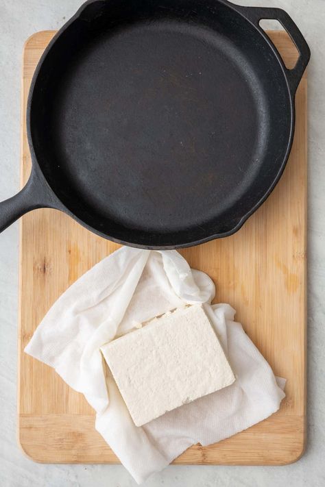 This quick tutorial teaches you how to press tofu at home without a tofu press! It is super easy and only requires a heavy pan and some paper towels. | How to Press Tofu | How to Press Tofu without a Press | Pressed Tofu | Easy DIY Pressed Tofu | How to Press Water Out of Tofu | Pressed Tofu, Press Tofu, Freezable Recipes, Tofu Press, Southwest Quinoa Salad, Feel Good Foodie, Freezable Meals, How To Press Tofu, Kitchen Basics