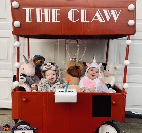 Claw Game Costume, Pumpkin Patch Stroller Costume, Twins First Halloween Costumes, The Claw Halloween Costume, Claw Machine Costume Wagon, Claw Machine Halloween Costume, Family Costumes With Wagon, Wagon Costumes For Babies, Family Halloween Costumes With Wagon