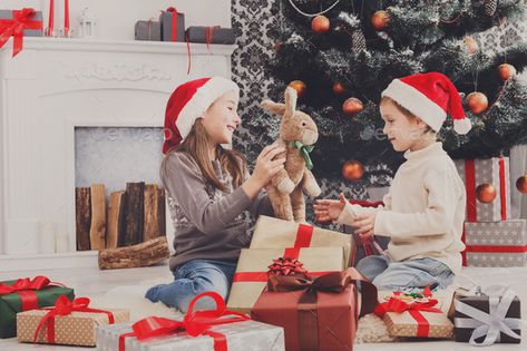 Happy children in santa hats unwrapping christmas presents by Prostock-studio. Cute happy excited children, boy and girl in santa hats unwrap rabbit christmas present on holiday morning in beautif...#presents, #christmas, #Prostock, #Cute Christmas Present Background, Opening Christmas Presents, Toys For Kids Boys, Rabbit Christmas, Engineering Toys, Holiday Morning, Meet Santa, Construction Trucks, Christmas Shoot